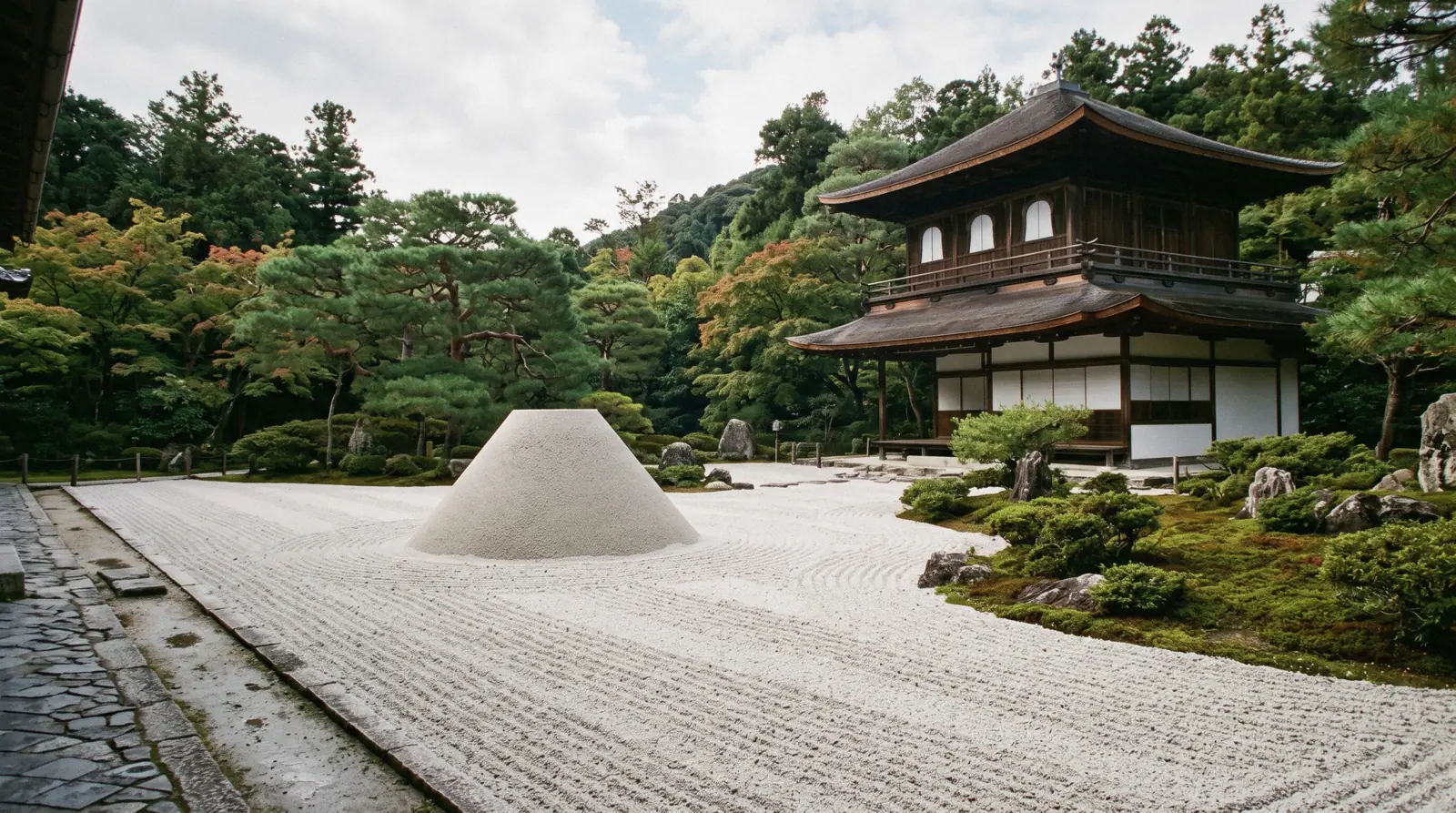 The raked sand cone and sea of silver sand in front of the Silver Pavilion at Ginkaku-ji in morning light, Kyoto Japan