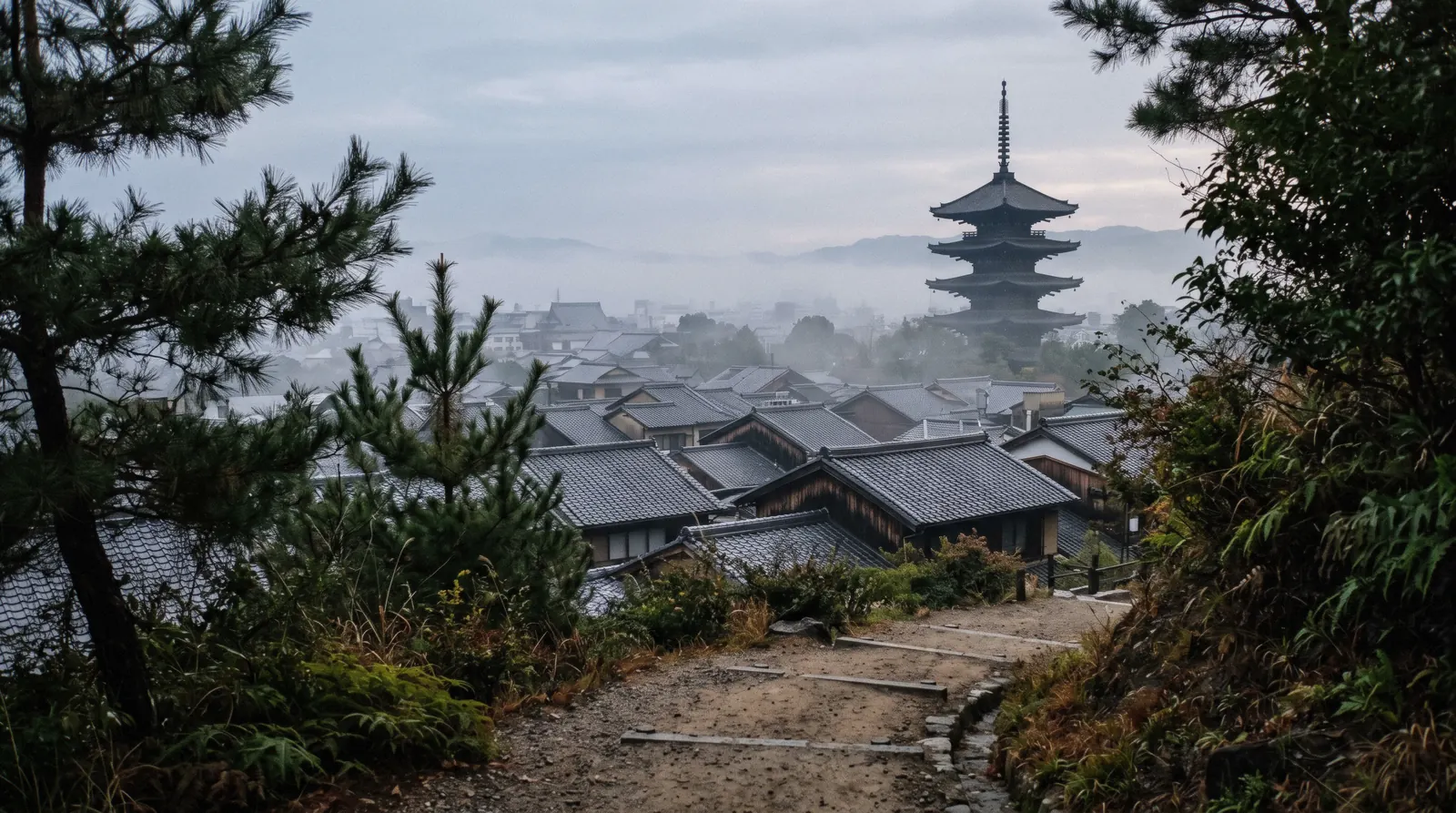 Rooftops and a pagoda under morning mist from a hillside path, Kyoto in 3 days Japan