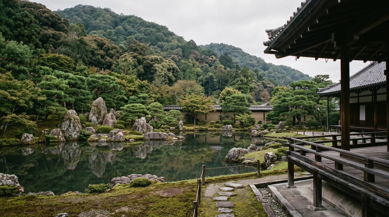 The Sogen pond garden at Tenryu-ji with the Arashiyama hills behind it in morning light, Kyoto Japan